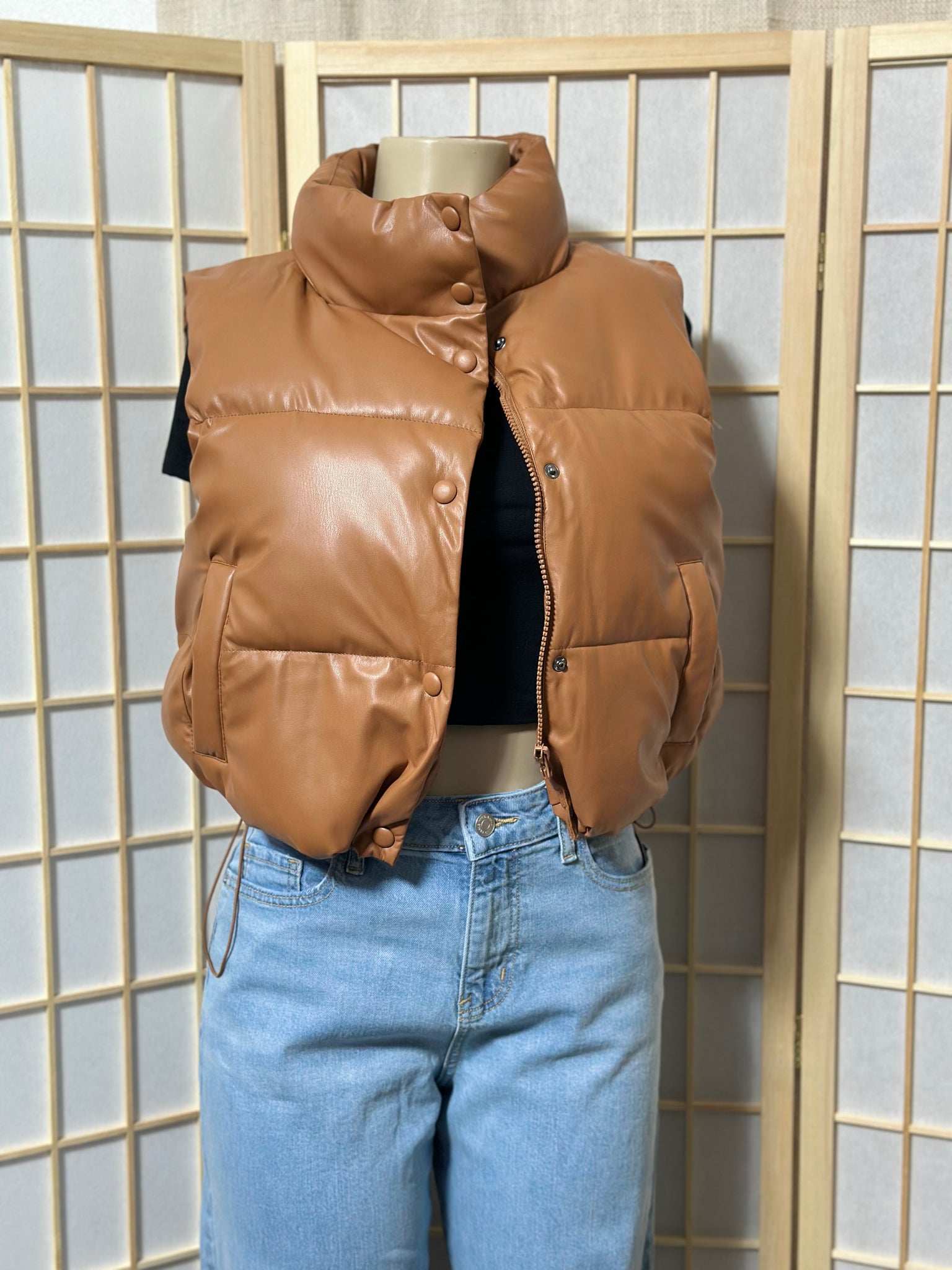 The “Trendsetting” Faux Leather Puffer Vest In Brown