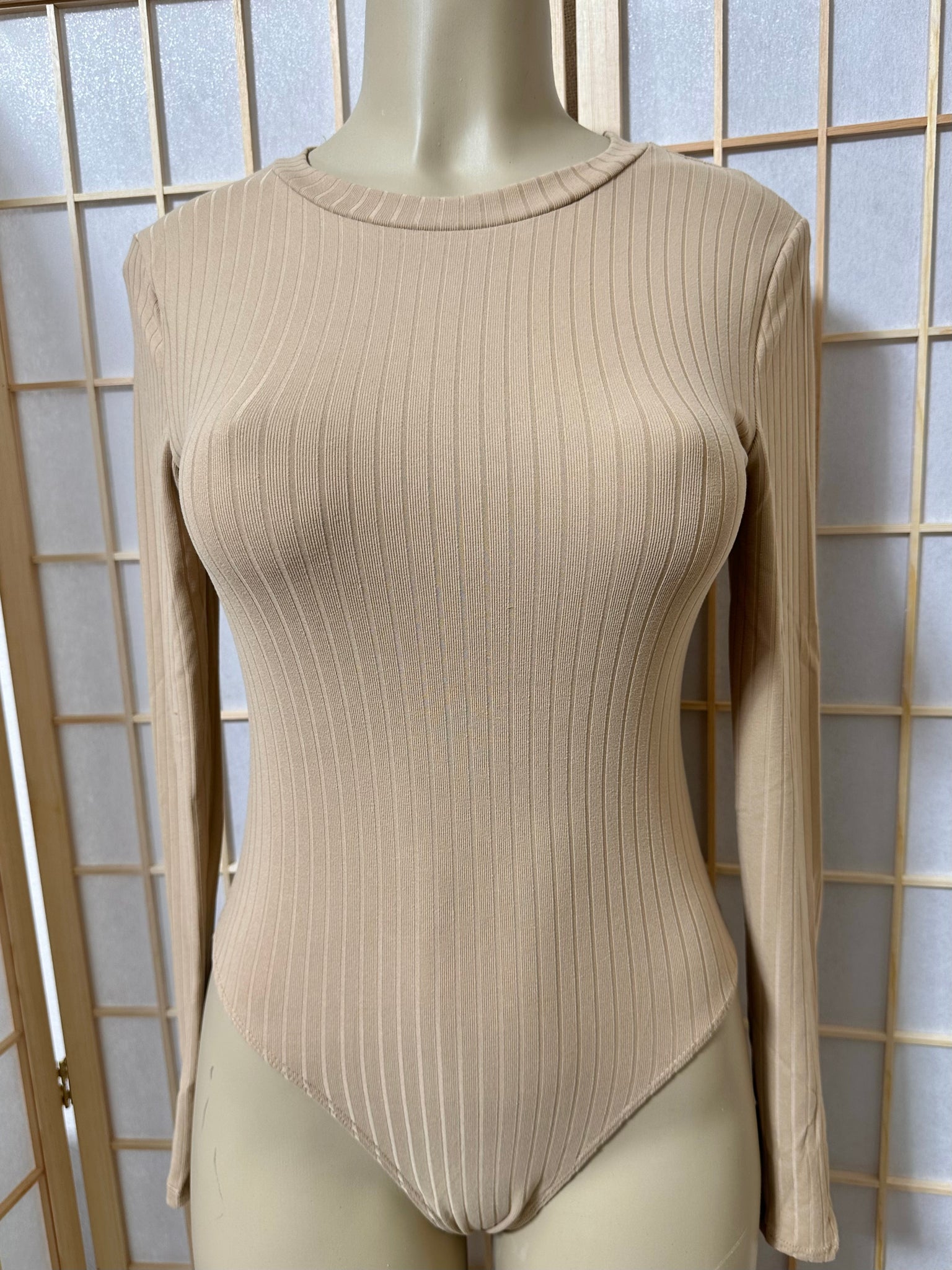 The “Nicole” Ribbed Bodysuit In Nude