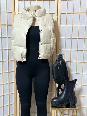 The “Trendsetting” Faux Leather Puffer Vest In Ivory